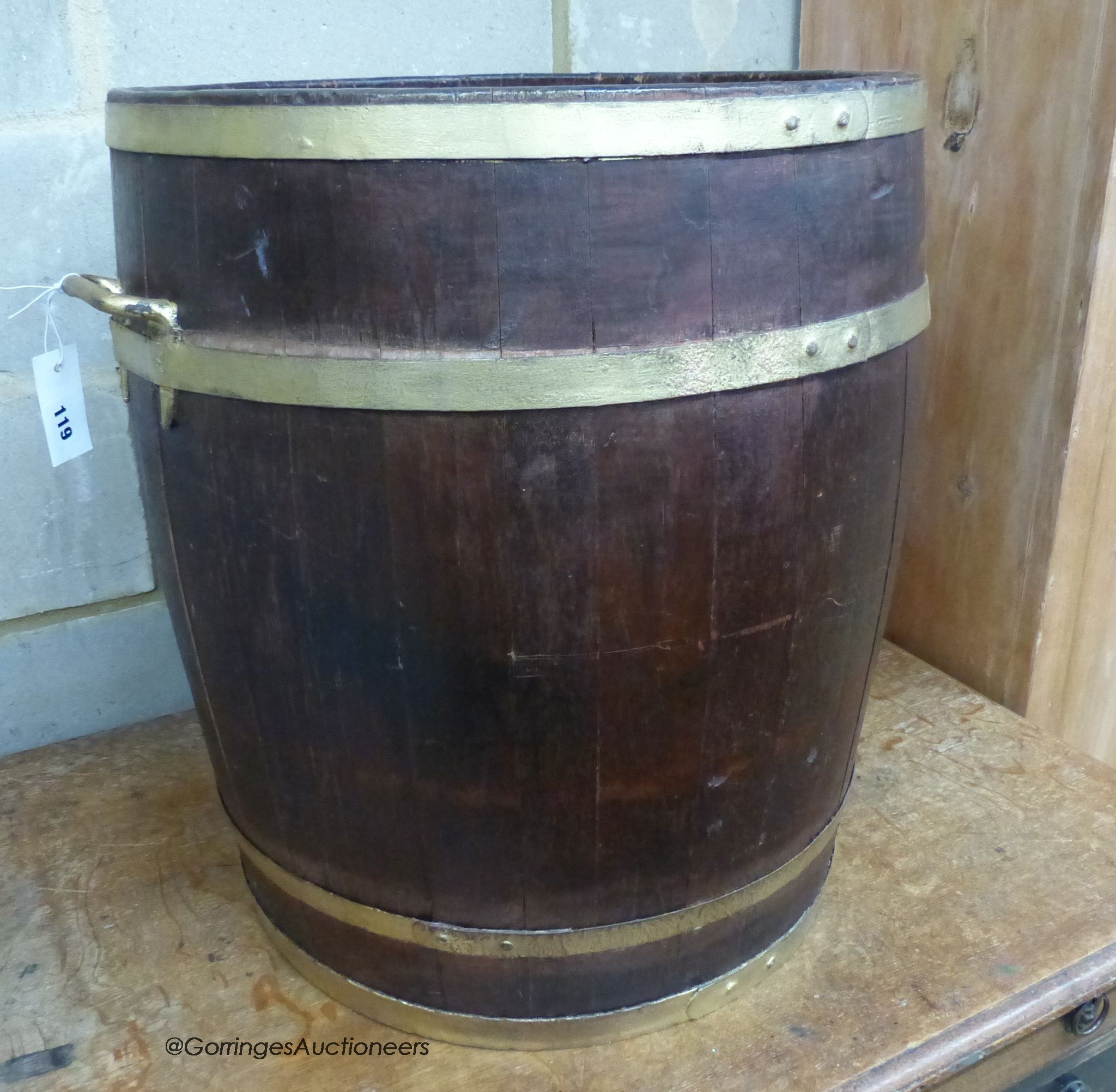 A circular staved oak two handled coopered barrel, 54cm diameter, height 58cm